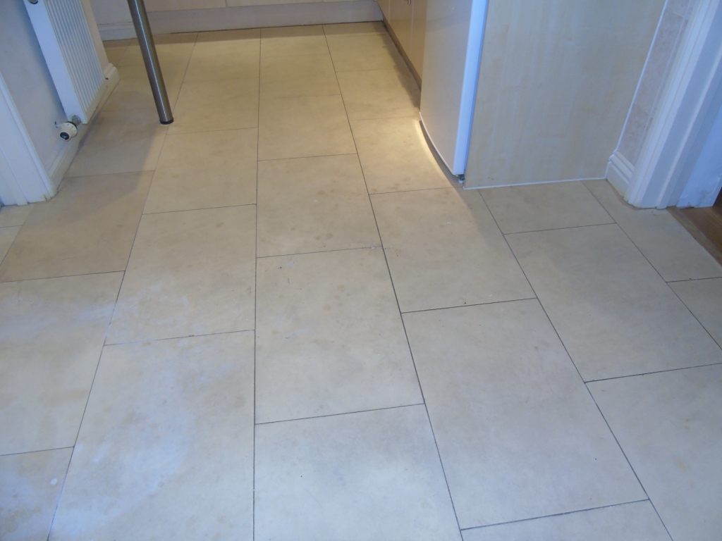 Pale, stained limestone floor before restoration