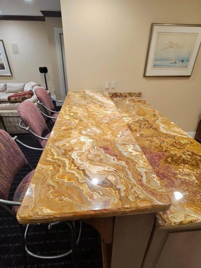 The finished onyx bar top with a high-gloss, glassy polish