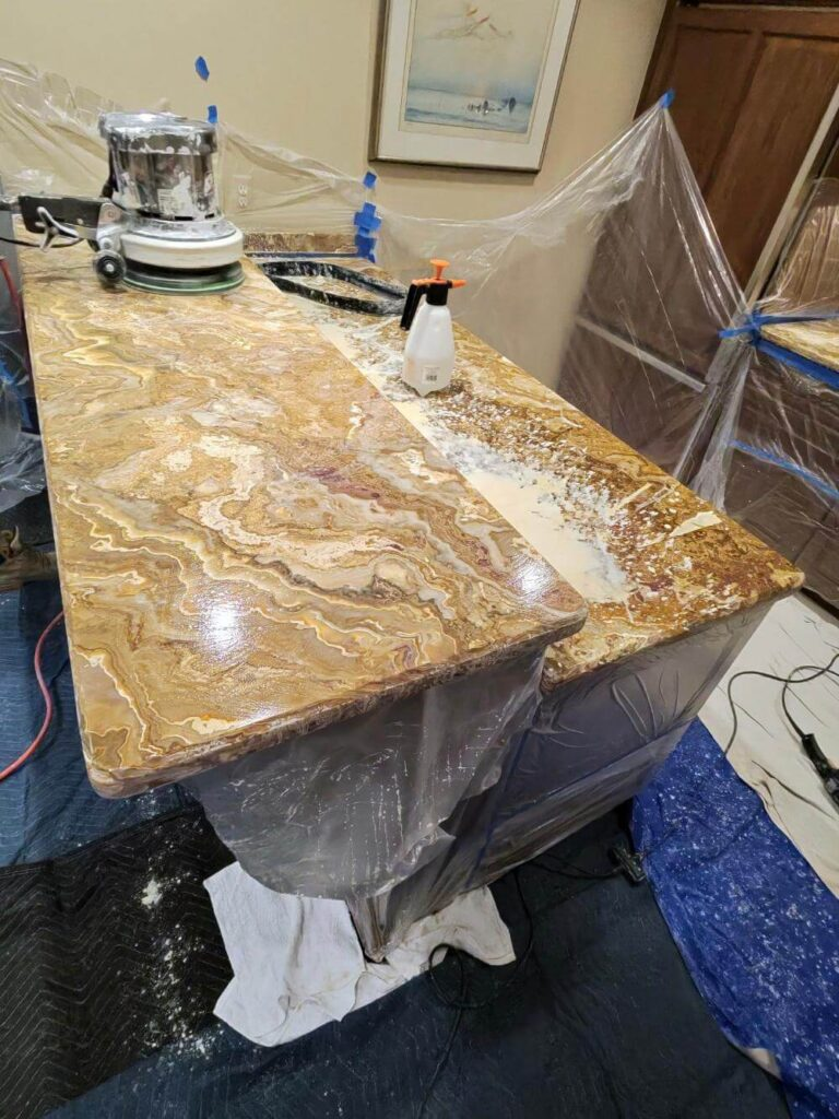 Onyx bar top mid-restoration, being ground and polished section by section
