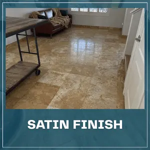 The same room with a restored, satin-finish travertine floor